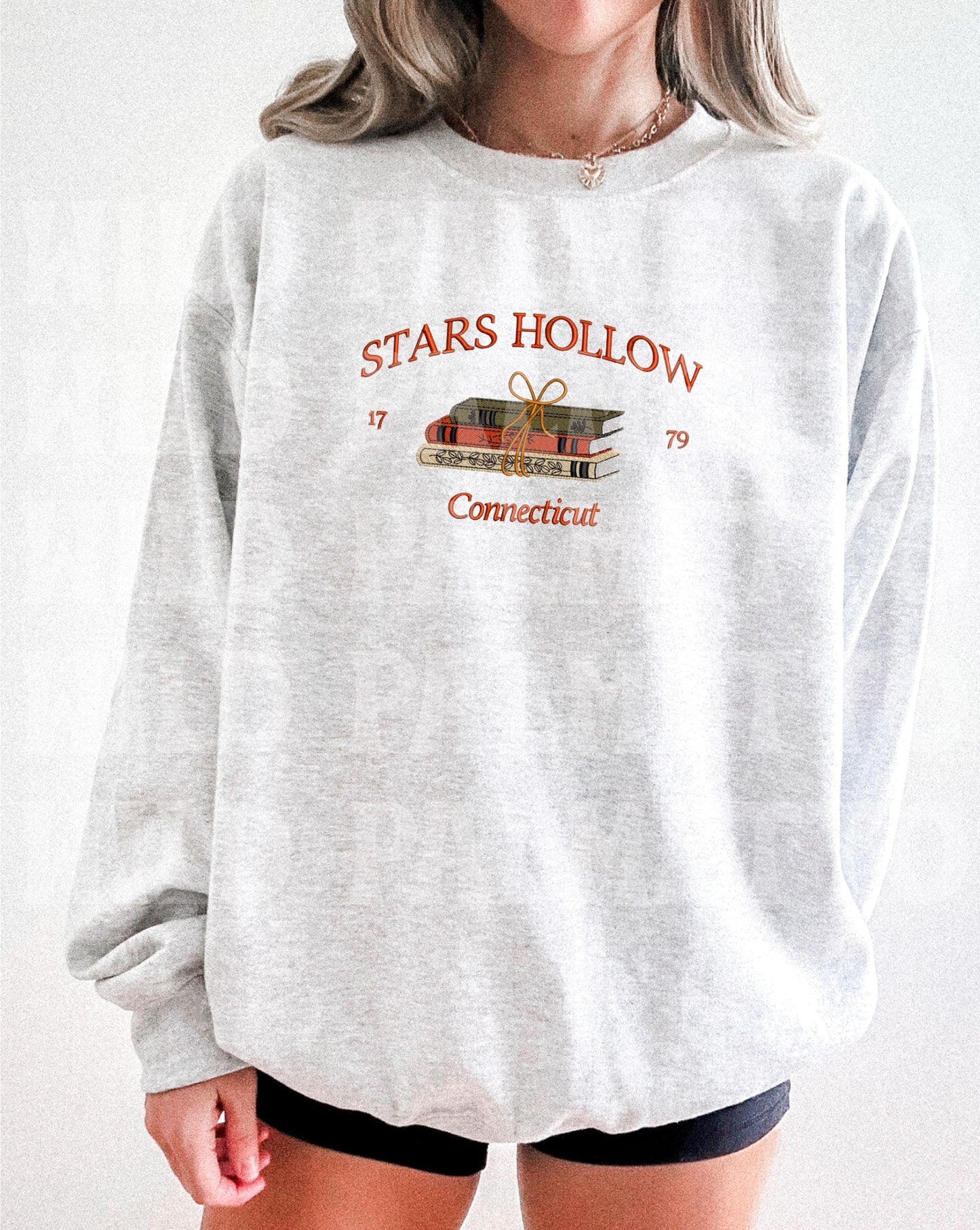 STARS HOLLOW BOOKS EMBROIDERED SWEATSHIRT