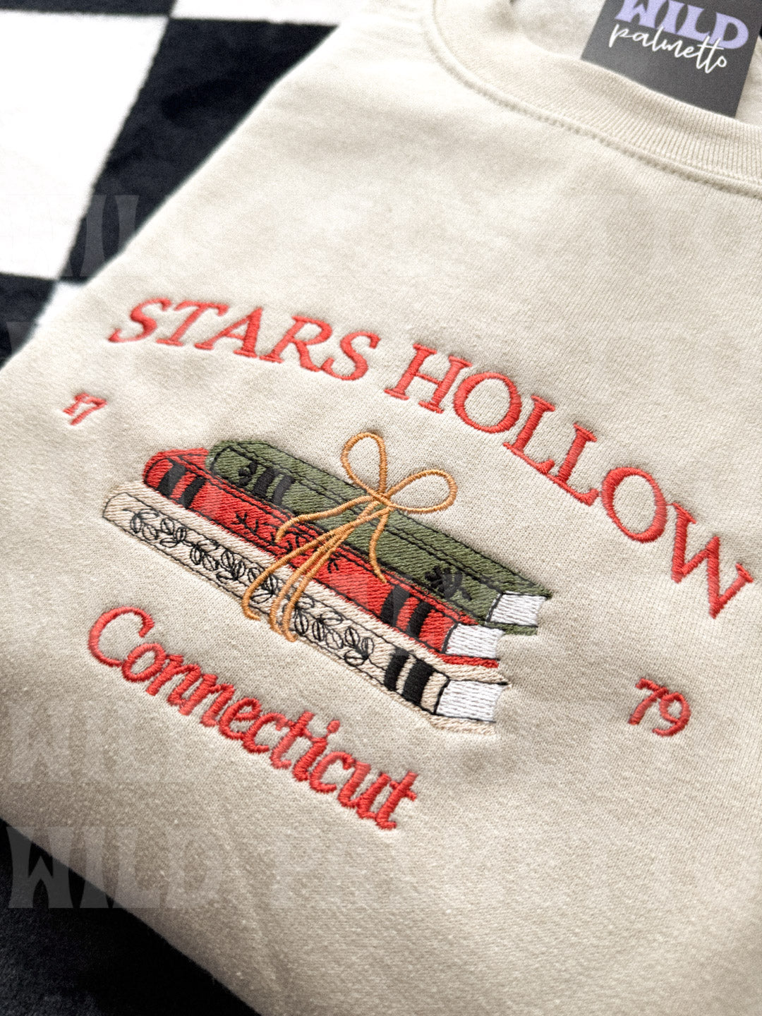 STARS HOLLOW BOOKS EMBROIDERED SWEATSHIRT