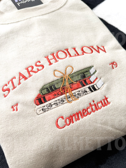 STARS HOLLOW BOOKS EMBROIDERED SWEATSHIRT